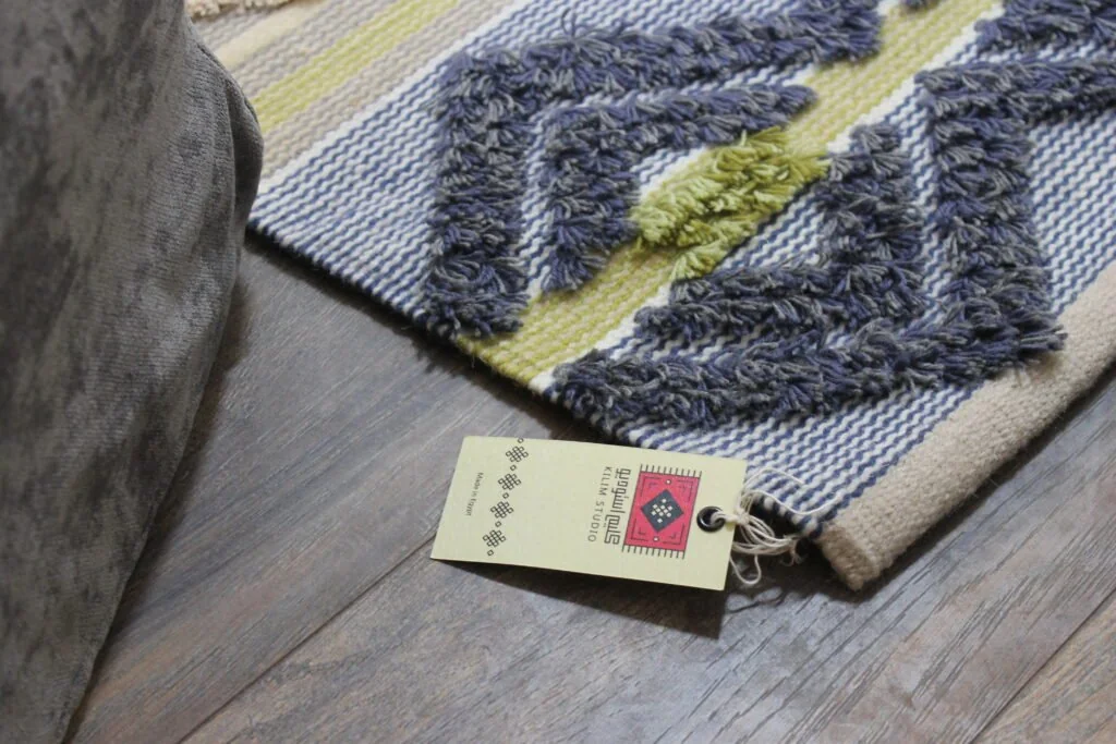 A closer look at the handwoven texture and detailing of a Kilim Studio rug